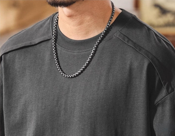 Shoulder Splice Panel Loose Tee in Black